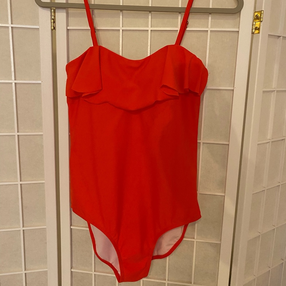 Coral one-piece swimsuit, ruffled top